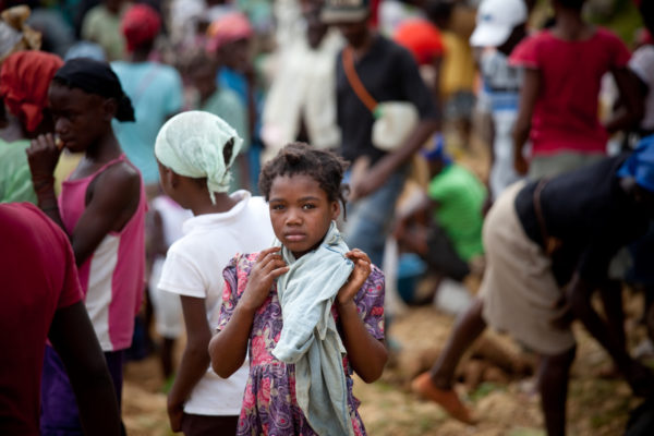 A girl with scarf stands out from the crowd in a market near Caye Michel in the Massif de la Hotte, Haiti