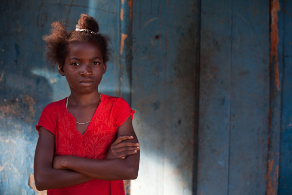 Girl folding her arms near Port Salut in the Tiburon Peninsula, Haiti