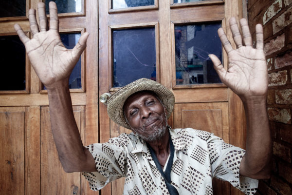 A man raises his hands in Les Cayes on the Tiburon Peninsula, Haiti